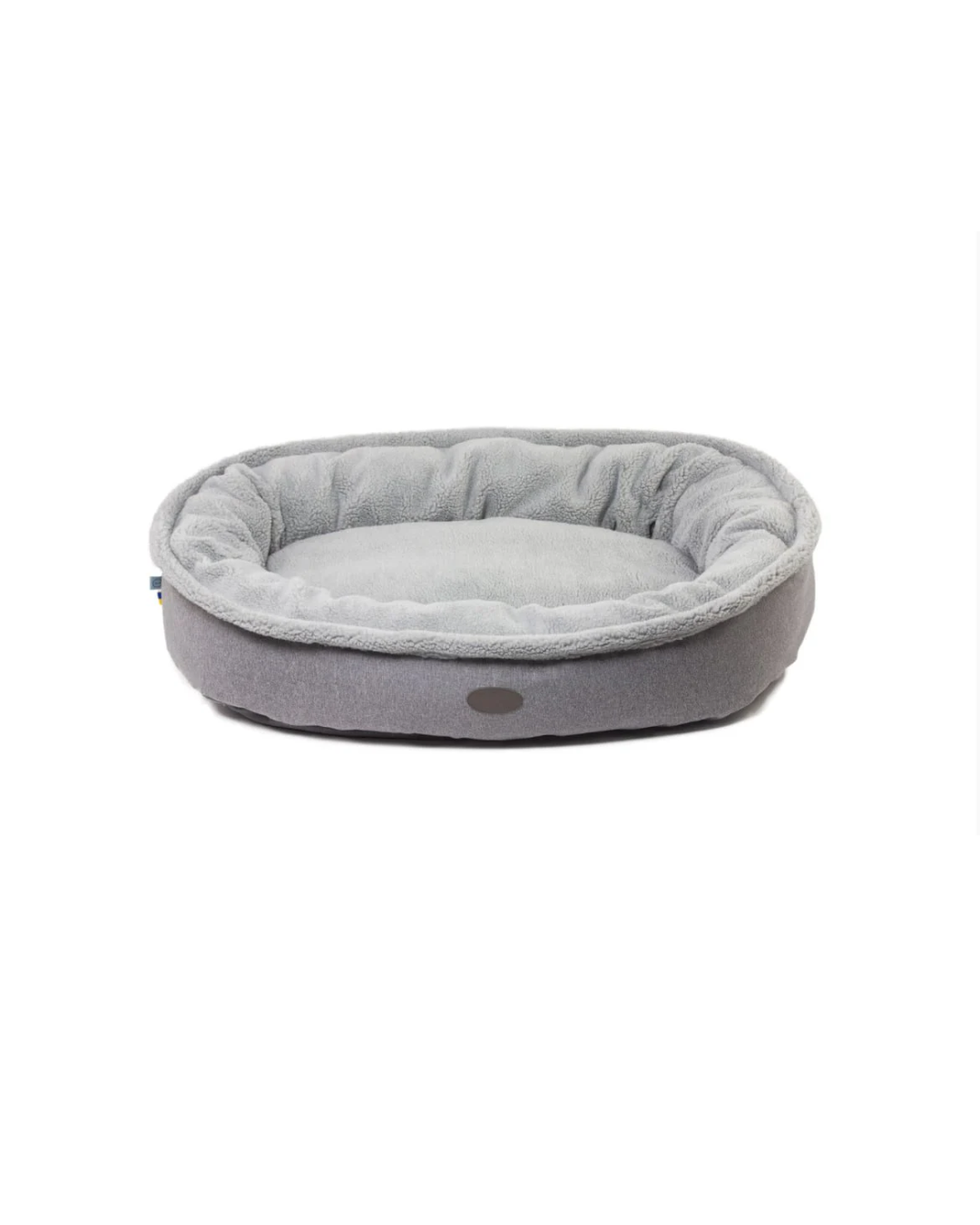 Furry bagel dog bed with faux shearling interior and velvet shell