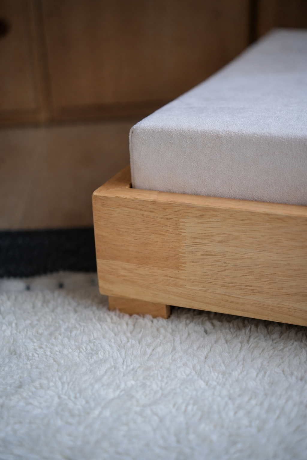 Luxury dog bed with solid hardwood frame and orthopedic memory foam